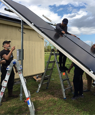 ECSU student-led projects involving wind turbines and solar sheds have been installed behind Dixon Hall