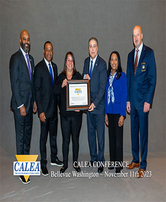 L to R Marlon Lynch, CALEA Chair/Commissioner, Lamond James, ECSU Campus Police Sergeant, Shara Chivers, ECSU Campus Police-Clery Coordinator/Accreditation Manager, Robert Thibeault, Vice Chancellor for Budget and Finance, Karrie G. Dixon, ECSU Chancellor and W. Craig Hartley Jr., CALEA Executive Director