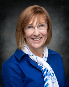 Christine Evans, Board of Trustee Member, smiling in headshot