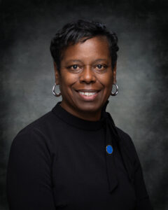 Patricia Norman, Secretary of the Board of Trustees, smiling in headshot