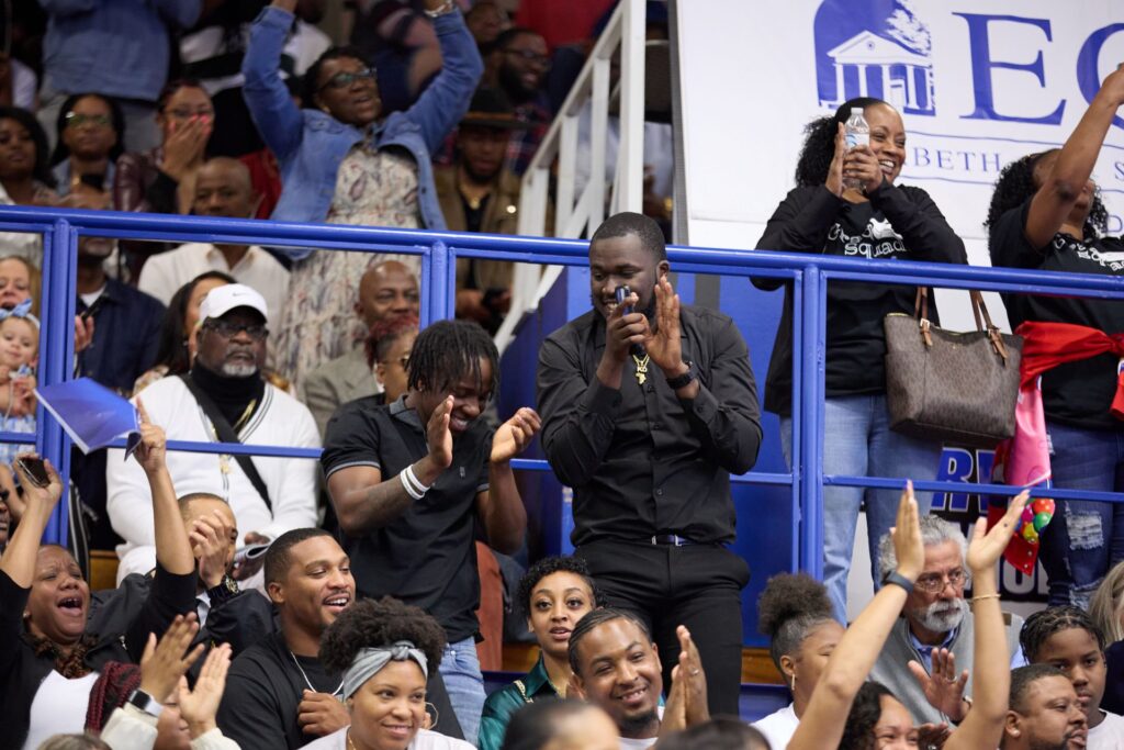 Crowd cheering in the stands of the Vaughan Center Gymnasium during Commencement.