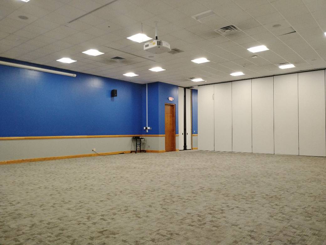 Wide shot of the front of a room 124 quarter ballroom in K.E. White Graduate Center.