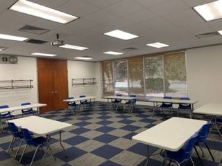 Wide shot of the back of room 130 of the K.E. White Graduate Center.