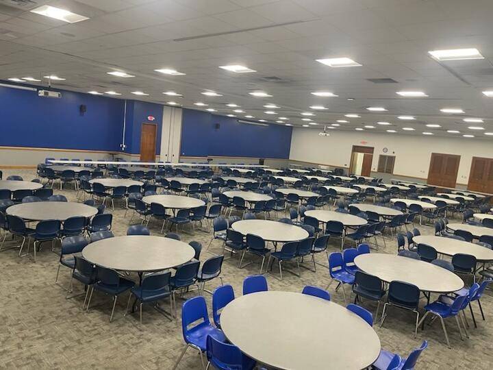 Wide shot of the full ballroom in K.E. White Graduate Center with tables and chairs laid out.
