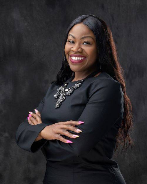 Amber Lennon, Executive Director of Career and Professional Development & QEP for the Career Development Center, smiling in headshot